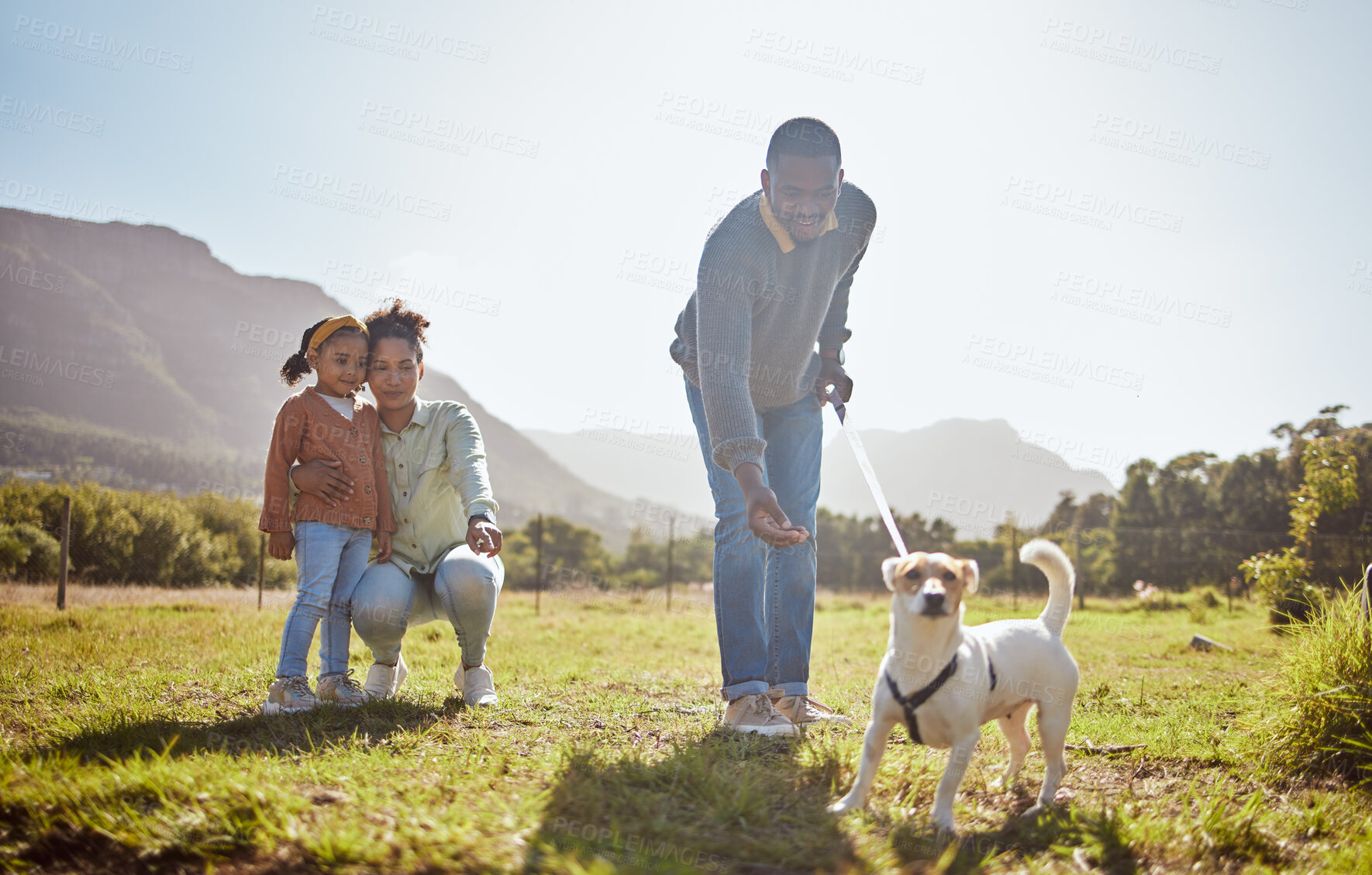 Buy stock photo Dog, walking and family relax together in nature park enviroment. Black family, pet and father walk puppy in garden with mother and child for freedom, happiness and animal care on countryside field