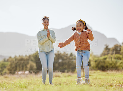 Buy stock photo Mother, girl and child jumping, playing and clapping in game in nature park, garden environment or sustainability field. Smile, happy or cheering mom and kid in energy, freedom or fun summer activity