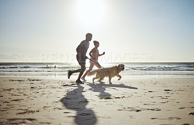 Buy stock photo Couple, beach and running with dog for health, wellness or exercise. Mock up, diversity and man, woman and animal outdoors on sports run, exercising or workout jog on sandy seashore or ocean coast.