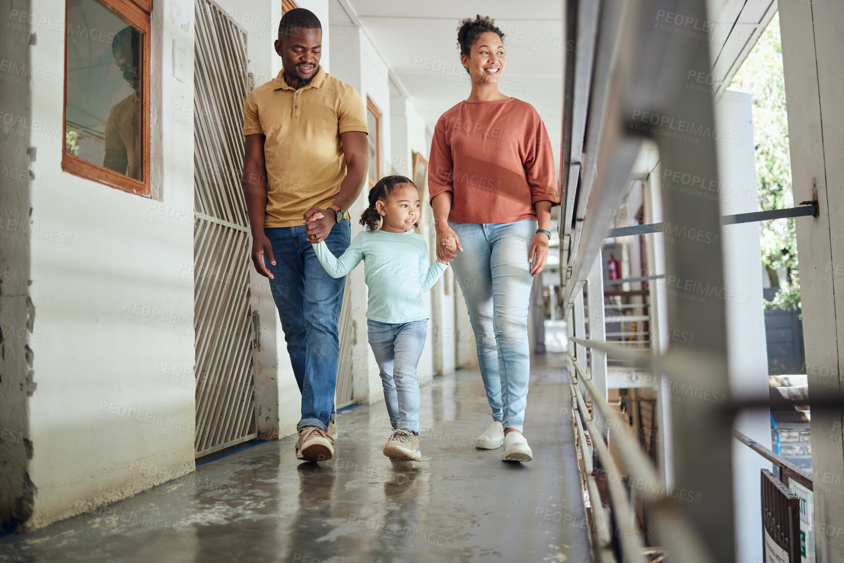 Buy stock photo Black family, parents or girl bonding in animal shelter, community volunteer charity or homeless pets center. Smile, happy child or holding hands and walking mother, father or rescue adoption kennel