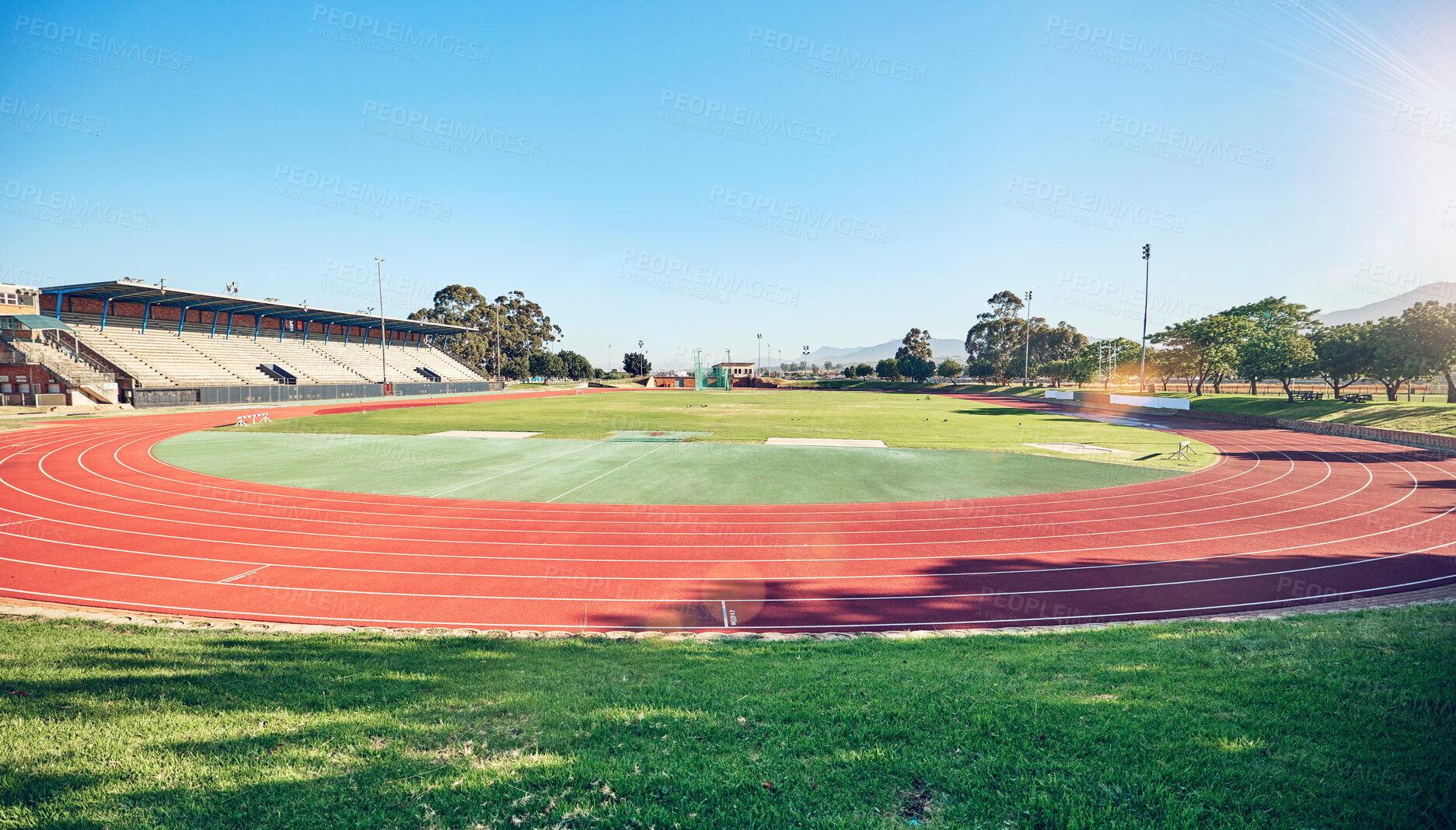 Buy stock photo Empty running track, arena or stadium architecture for marathon race, sports cardio training or fitness workout. Blue sky, olympic course and event field for athletics contest, competition or games