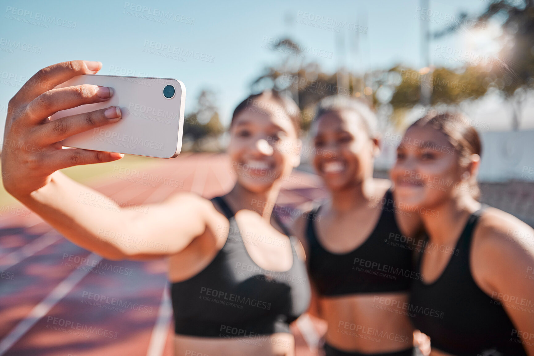 Buy stock photo Sports, women and selfie with runner group at a running track for fitness, training and workout outdoors. Friends, phone and girl athlete team bond, smile and take picture at a stadium for exercise 