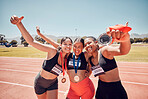 Medal, winner and athlete women at a stadium sports, competition or race success in group hug portrait. Runner people, team or friends with gold award, winning champion and achievement on race track