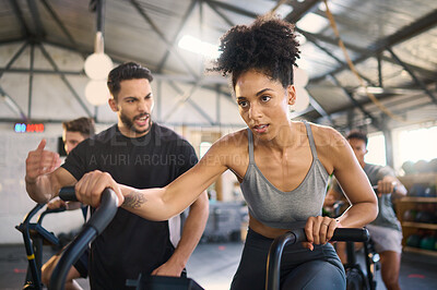 Buy stock photo Exercise bike, motivation and personal trainer with a black woman in gym for exercise or fitness. Wellness, training and cycling with a female and coach working together in a health or wellness club