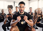 Squat, kettle bell and fitness coach in a gym exercise, fitness and workout wellness class. Portrait of a sport personal trainer with focus on training people for health goals and sports cardio 