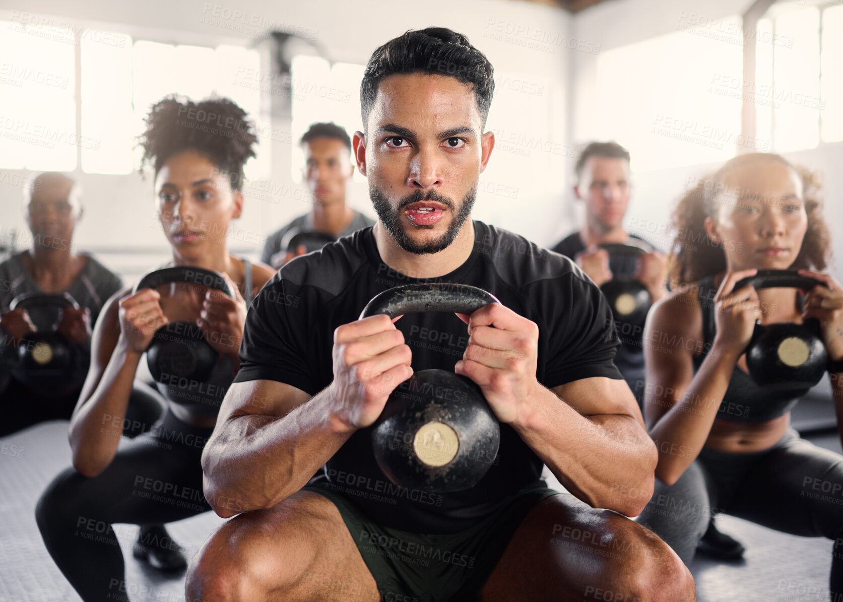 Buy stock photo Squat, kettlebell and fitness coach in a gym exercise, power and workout wellness class. Portrait of a sport personal trainer with focus on training people for health goals and sports cardio 