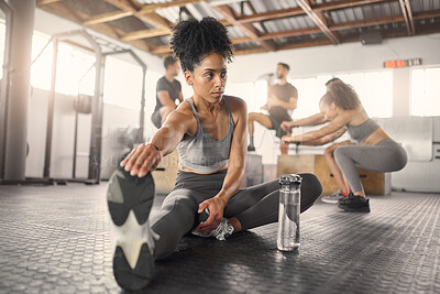 Buy stock photo Stretching, fitness and training with black woman in gym with water bottle for exercise, sports and workout. Health, wellness and energy with girl and legs warm up for performance, muscle and strong