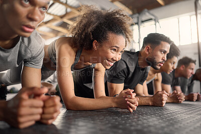 Buy stock photo Fitness, woman and plank exercise in group training gym for wellness, healthy lifestyle and workout. Strong, young and happy black girl, athlete and floor push up with friends for sports challenge 