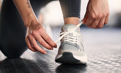 Buy stock photo Woman, hands and shoelace tie for gym workout, training or exercise in wellness, health or fitness club. Zoom, personal trainer and coach legs with sports shoes, body goals and challenge motivation