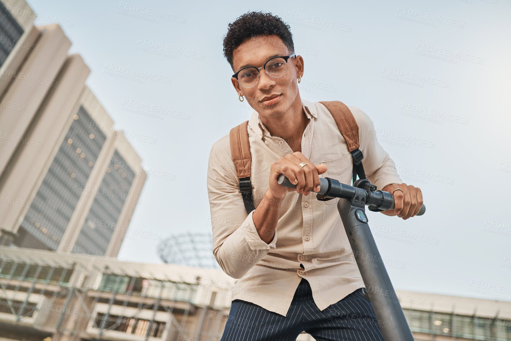 Buy stock photo Scooter, city and portrait of a student man for travel and transportation with carbon footprint, eco friendly and urban lifestyle. Young gen z college or university person with an electric scooter