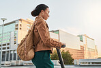 Black woman, electric scooter and city buildings while on road to travel with student, businesswoman or gen z girl using eco friendly transportation. Female with smile, energy and fun on a e-scooter