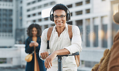 Buy stock photo Music, electric scooter and city with a black man on his commute to work or business in the morning. Portrait, headphones and transport with a male employee commuting or working in an urban town