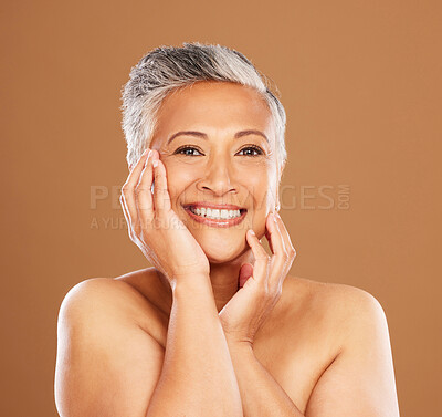 Buy stock photo Beauty, skincare and senior woman touching soft skin after cosmetics, makeup and dermatology for healthy, glow and clear face. Portrait and smile of mature model in studio for self care cosmetology