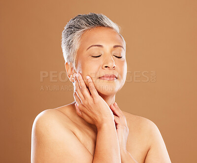 Buy stock photo Skincare, beauty and self care with a senior black woman on a brown studio background for makeup, cosmetics and dermatology mockup. Face glow, skin and botox for a mature model after a facial