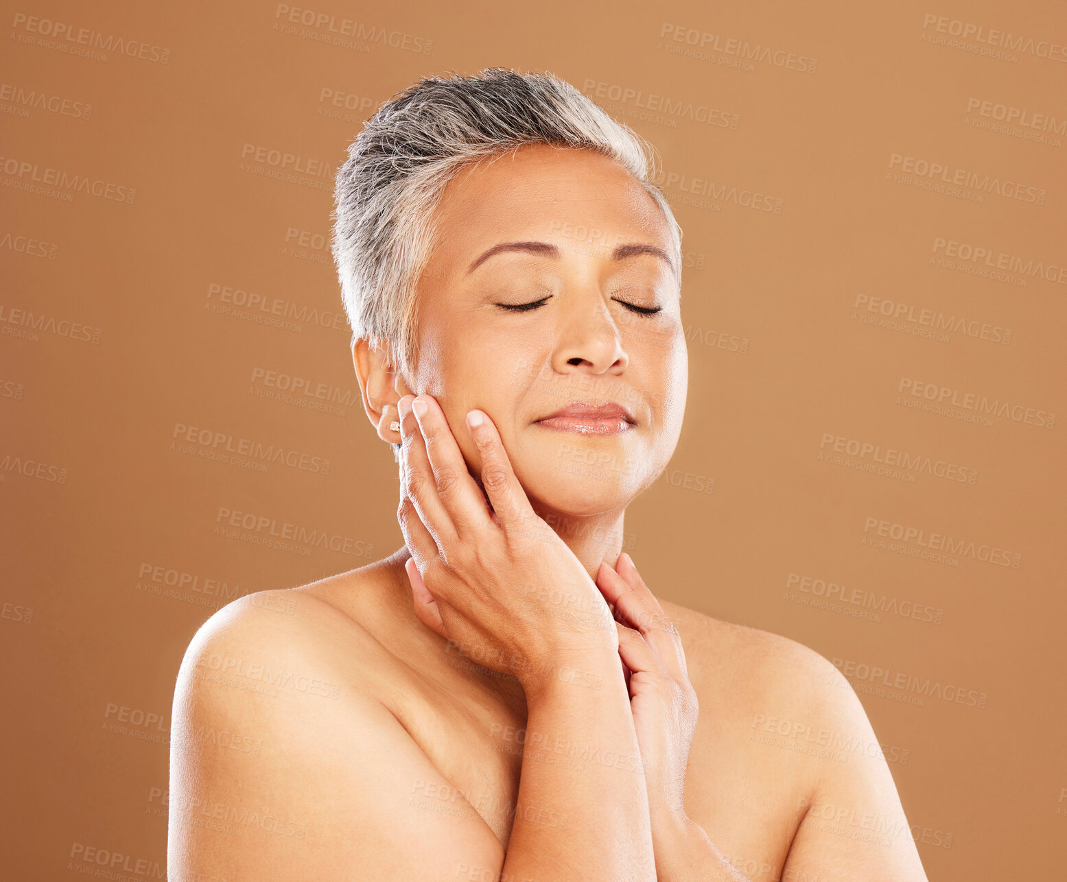 Buy stock photo Skincare, beauty and self care with a senior black woman on a brown studio background for makeup, cosmetics and dermatology mockup. Face glow, skin and botox for a mature model after a facial