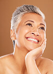 Face, beauty and thinking with a senior woman in studio on a brown background for wellness or natural skincare. Idea, cosmetics or skincare with a mature female posing to promote an antiaging product