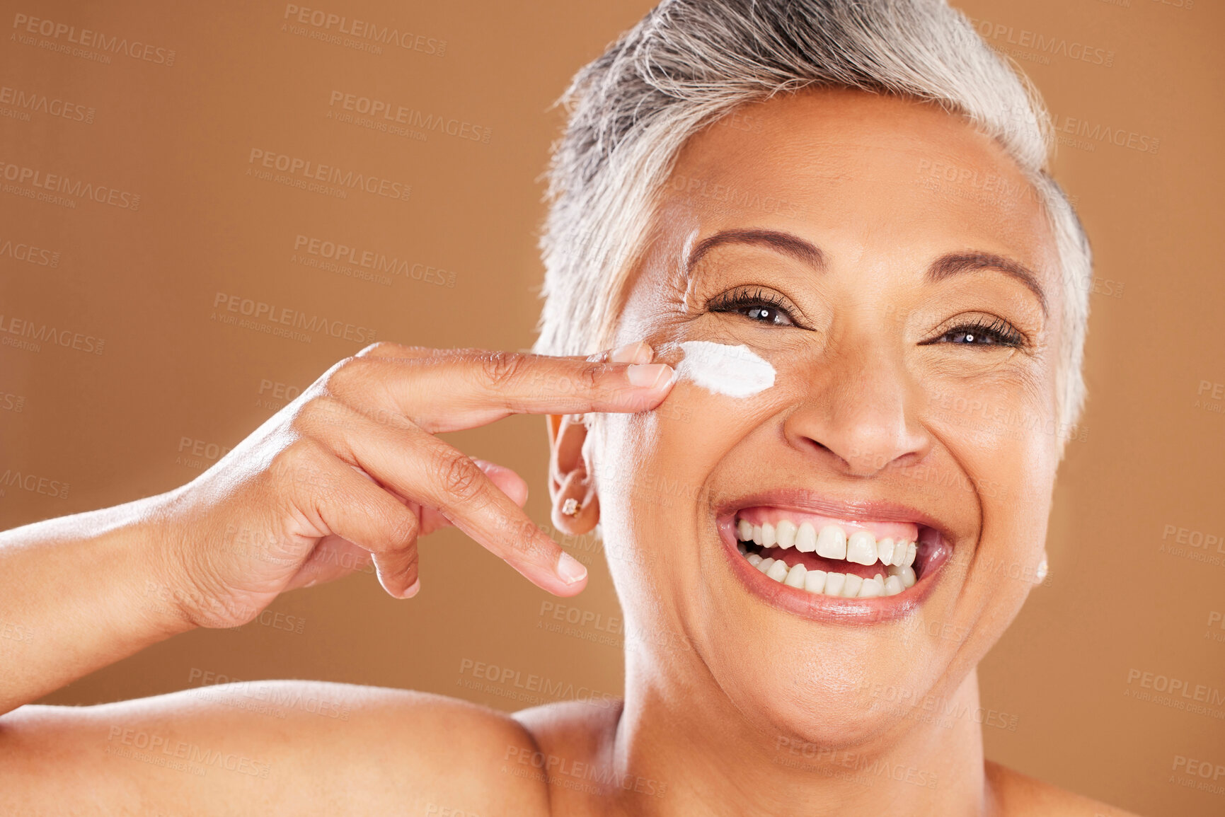 Buy stock photo Senior woman, sunscreen and face, skincare and happy smile in studio background. Mockup up for natural beauty, cosmetic products and wellness cream. Facial model for skin, cleaning and moisturizing