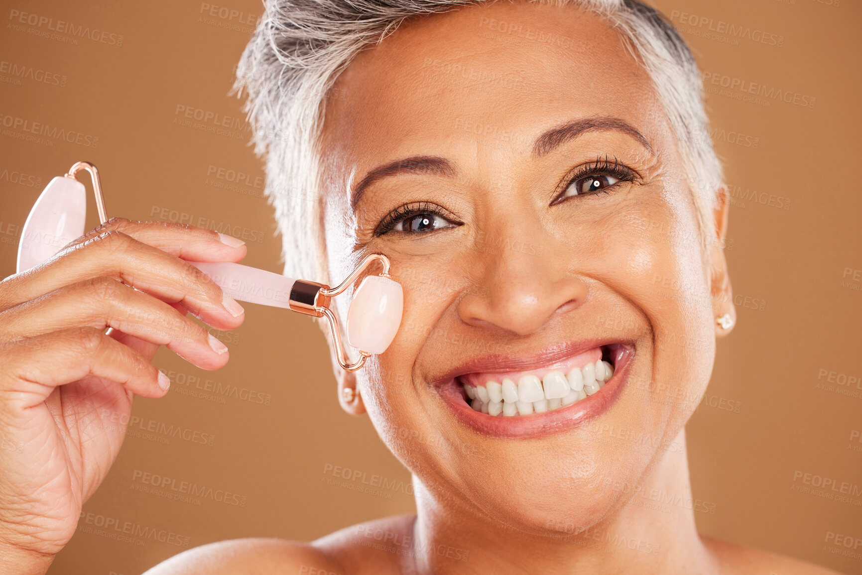 Buy stock photo Portrait of senior beauty, rose quartz roller and woman with facial cosmetics face routine natural, healthy skincare treatment. Smiling elderly black lady, wellness massage product and organic spa