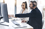 Teamwork, call center and business people in customer service working together in office. Collaboration, team and man looking at computer helping woman in telemarketing, customer care and crm company