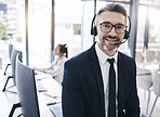 Communication, leadership and portrait of businessman at call center with vision at telemarketing company. Contact us, customer service and crm, happy ceo manager at customer service help desk office