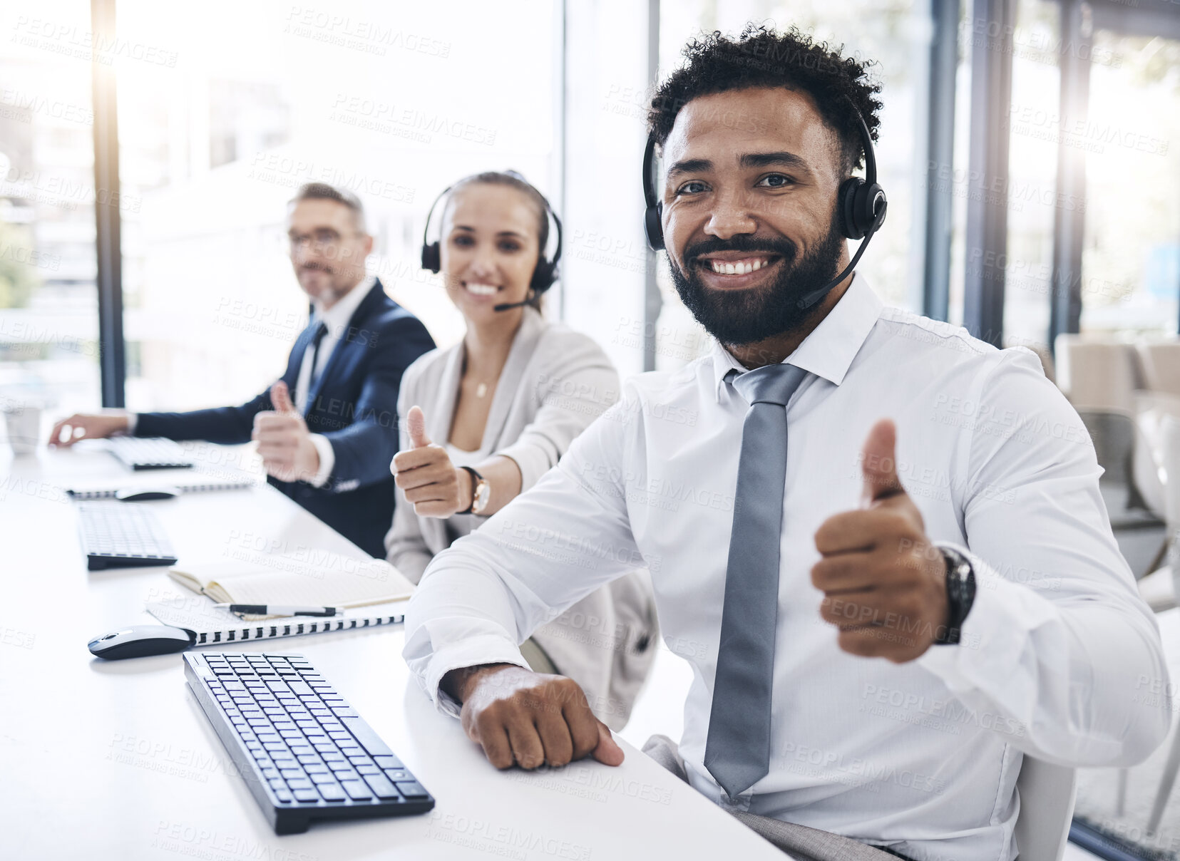 Buy stock photo Thumbs up, call center staff and black man, success in the workplace, diversity and crm in customer service or telemarketing. Employee portrait, yes gesture and contact us, communication agreement.