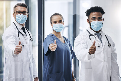 Buy stock photo Hospital, team and thumbs up for medical support in healthcare success. Mask, yes and covid safety compliance winner or clinic teamwork happiness in doctor laboratory office for clinical achievement