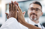 Group high five, diversity and hands together for teamwork, support and collaboration in the workplace. Solidarity, team building and professional friends with a goal, target and mission of success 
