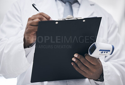 Buy stock photo Covid, doctor with thermometer and clipboard writing on patient chart or medical insurance documents. Research, innovation in healthcare and black man with paperwork in hands for safety in hospital.