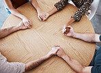 Business people holding hands in therapy group, team building or staff support with diversity, empathy and solidarity. Corporate circle hand holding on table above for prayer, trust and community