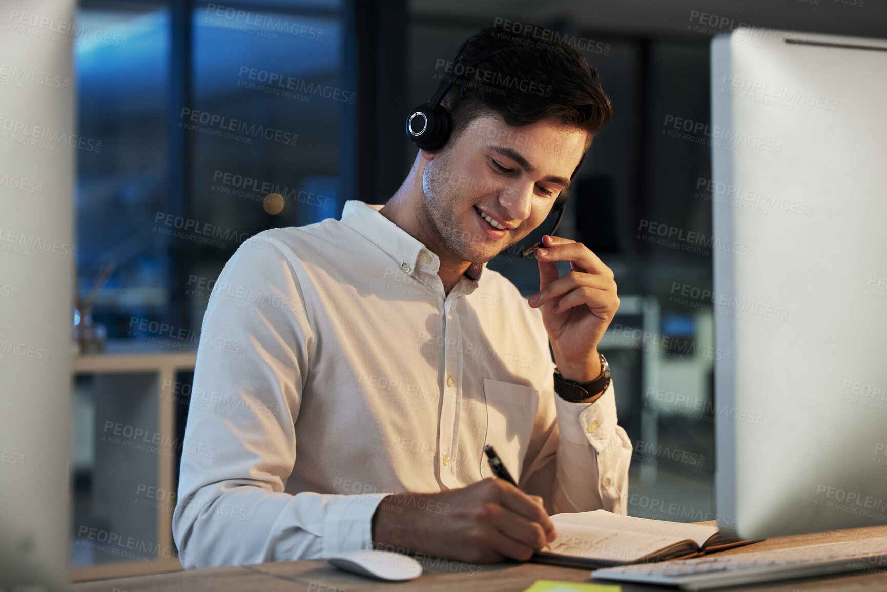 Buy stock photo Call center, night business man at global networking company with consulting strategy, telemarketing communication and virtual support. Crm, customer service and consultant agent on desktop computer