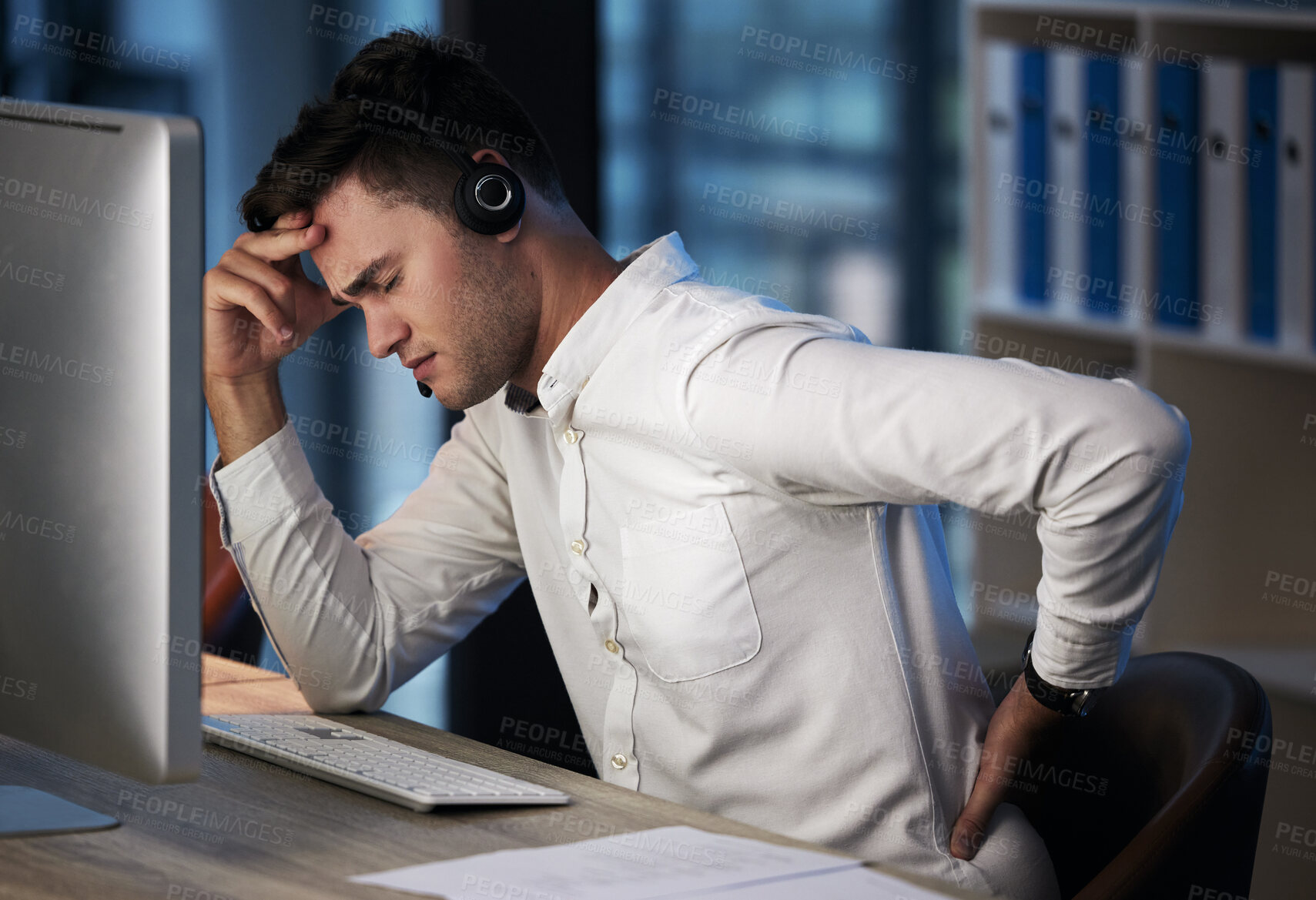 Buy stock photo Businessman, call center and back pain from burnout, headache or overworked late at night by the office desk. Man consultant suffering in pain, sore back or discomfort from long hours on the computer