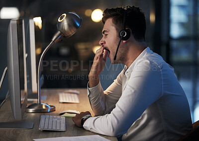 Buy stock photo Tired, yawn and call center man in office at night for telemarketing, customer service and crm consulting. Exhausted, sleepy and overworked young call centre salesman with burnout and fatigue at desk