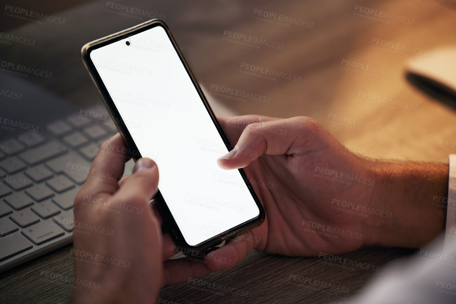Buy stock photo Hands, phone and mock up in night office for marketing or advertising. Mockup space, tech and man networking on 5g mobile, social media or texting online, checking email or scrolling on smartphone.
