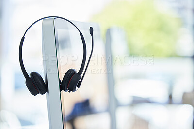 Buy stock photo Call center, headset and computer with office background, consulting and technology for crm, communication or help. Workplace, customer service or telemarketing pc on desk for work, agency or support