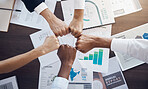 Hands, team and analytics in business meeting for collaboration, agreement or partnership at the office. Hand of employee group in fist bump for analysis strategy, teamwork or unity at the workplace
