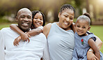 Happy black family, kids and portrait in park with love, pride or bonding together outdoor in summer. Happy family, black woman and man with children on grass for happiness, relax and vacation in sun