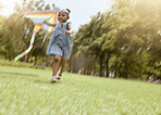 Girl, running with kite and nature park for happy, fun outdoor activity and freedom run in summer making childhood memory. Playful child, grass field and black kid playing outside on nature holiday 
