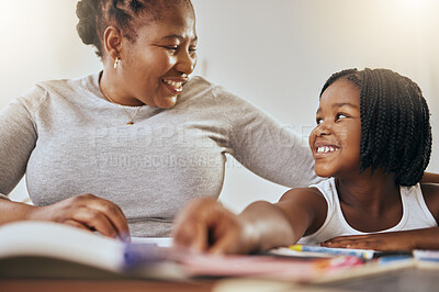 Buy stock photo Mother with young girl, learning with books in home and studying for test in Kenya. Homeschooling education, happy child writing homework and mama helping daughter with knowledge development