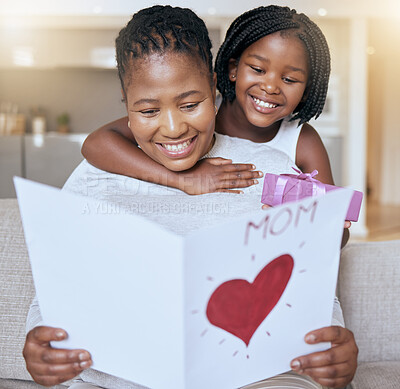 Buy stock photo Mothers day, gift and card with mom and girl on sofa for happy, celebration and surprise. Care, affection and hug with child giving mother heart present in living room of family home for gratitude 
