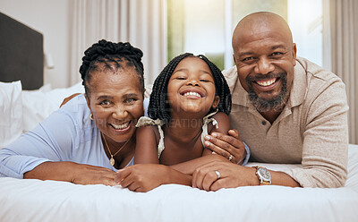 Buy stock photo Black family, bed and relax together in bedroom at home for relationship bonding. Happy family, parents smile and excited child portrait, smiling or lay in morning for happiness in family home