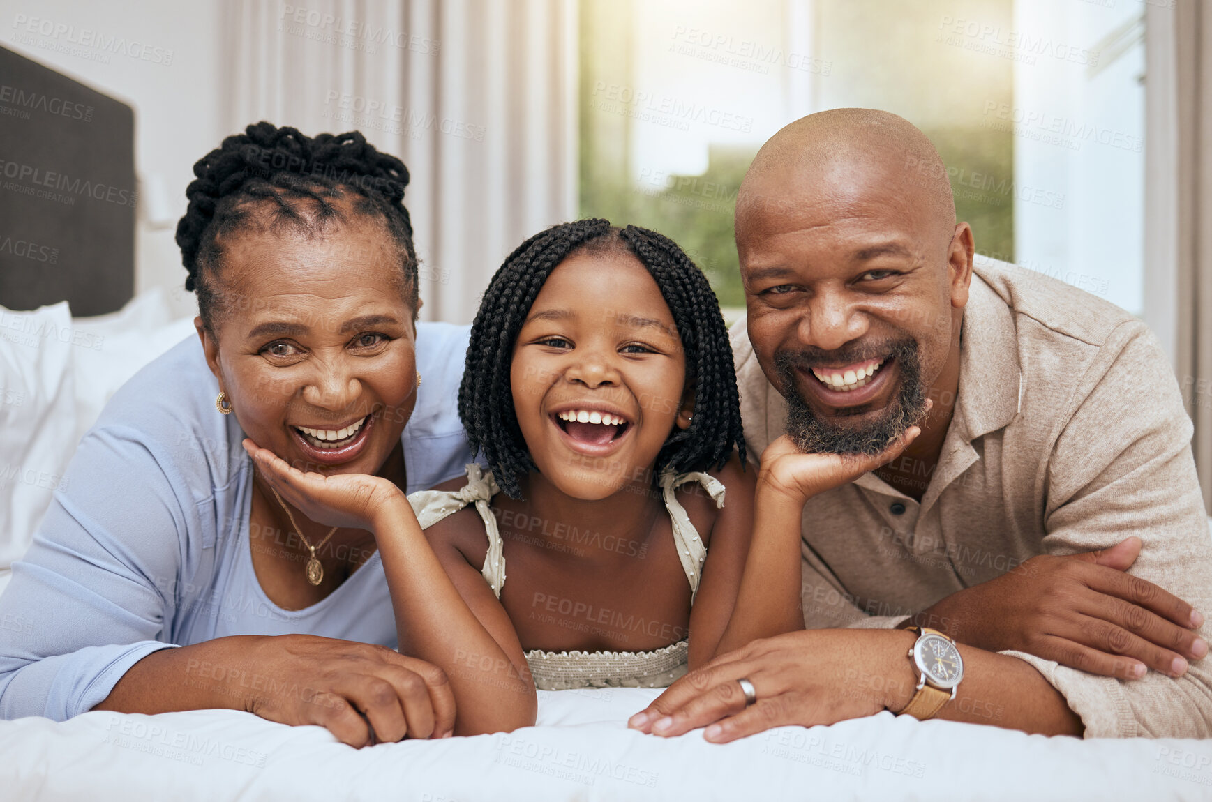 Buy stock photo Portrait of happy family home, girl and grandparents on bed for fun morning, relax lifestyle. Smile senior man, black woman and playful kid child face together in bedroom for love, care and joy