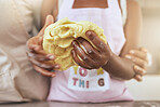 Child, hands and dough with mother in kitchen for learning, cooking or baking in home together. Closeup, cooking and girl with mom, baker and teaching preparation of cake, cookie or biscuit in house