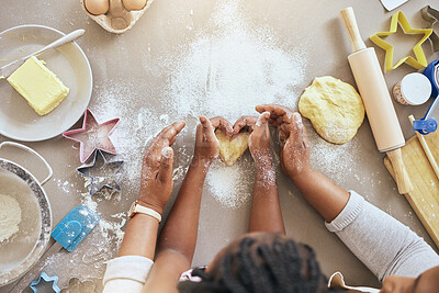 Buy stock photo Black woman, child hands or kitchen baking of heart shape pastry, house cookies or dessert biscuit scone in family home. Top view, mother or girl cooking food in help, support or learning cake recipe