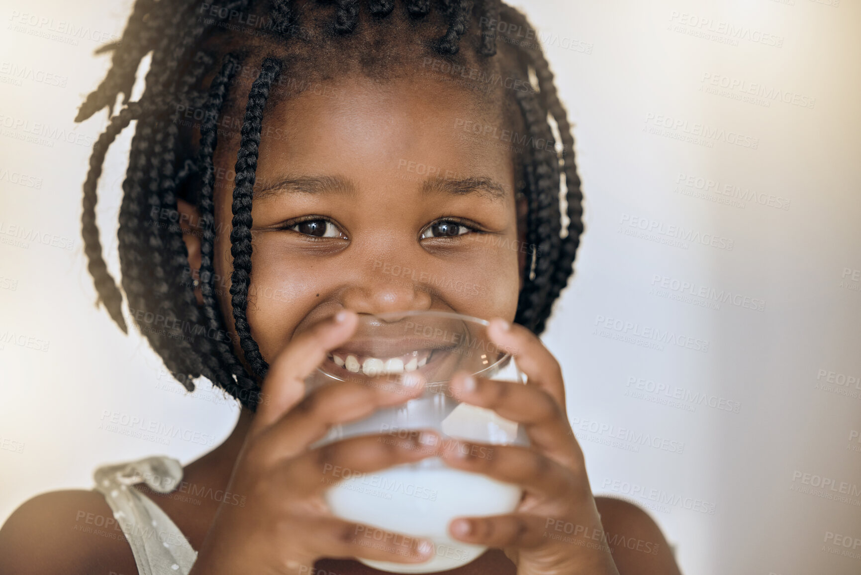 Buy stock photo Milk, health and nutrition portrait of black kid for wellness, calcium and diet with smile. Young, girl and happy child holding dairy drink in glass for a healthy lifestyle with mockup.

