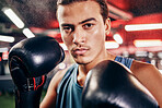 Man, boxing portrait and mma training for sports health fitness in gym. Healthy exercise workout, focus boxer face and hands ready with boxing gloves for fist fight competition in boxing studio