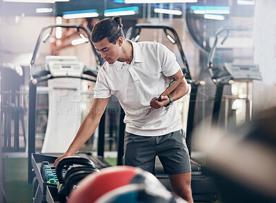 Buy stock photo Gym, man and equipment clipboard with male manager checking weights in a health club for fitness. Exercise, workout and sports with a young man writing notes or list for a healthy, fit lifestyle 