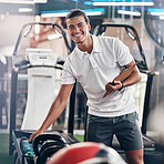 Training, portrait and fitness coach doing inspection of equipment at the gym. Wellness, sport and happy trainer doing check, planning and working at a club for athlete health, sports and workout