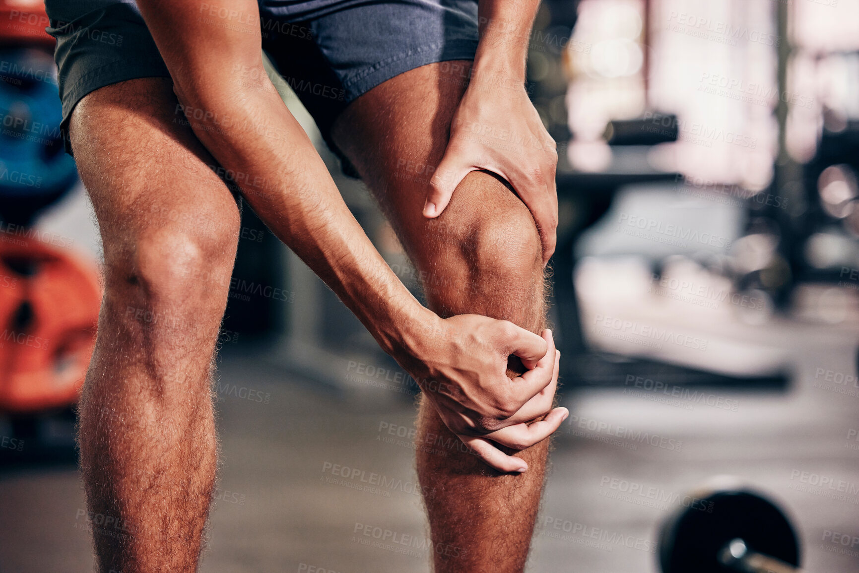 Buy stock photo Fitness, exercise and man with knee pain in gym holding leg after injury, accident and muscle pain. Healthcare, sports and male athlete with sore joint, hurt after exercising, workout and training