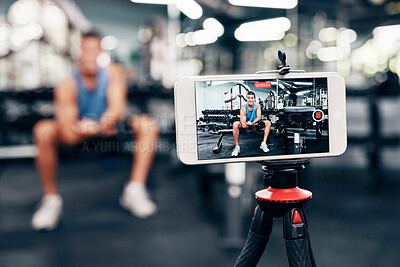 Buy stock photo Gym, social media and fitness influencer with phone live streaming workout for interactive multimedia broadcast. Vlog, man filming arm exercise and training coach video recording online blog tutorial