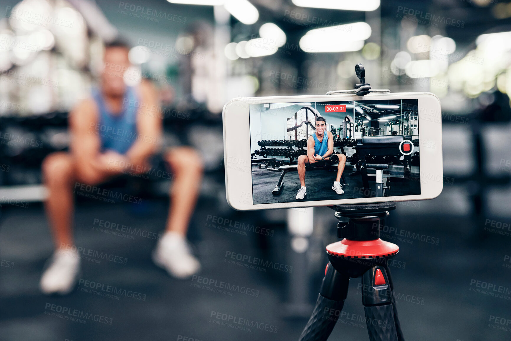 Buy stock photo Gym, social media and fitness influencer with phone live streaming workout for interactive multimedia broadcast. Vlog, man filming arm exercise and training coach video recording online blog tutorial